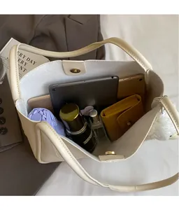 Internal view of beige tote bag showing large capacity for tablet, umbrella and cosmetics