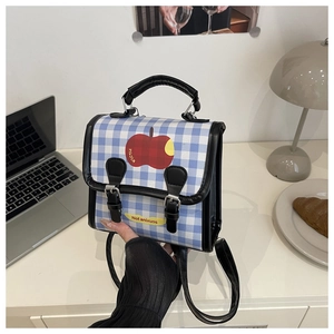 Detail of blue and white checkered backpack with apple print and double buckle closure