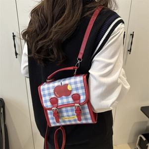 Fashionable blue plaid crossbody bag with red apple pattern and matching top handle