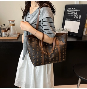 Detail of large brown tote bag with bear diamond pattern in a cafe setting