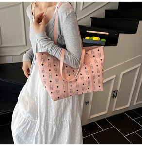Pink large capacity tote bag with bear pattern and long handles for shoulder wear