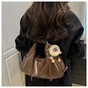 Brown leather Hobo bag with stylish silver zippers, long tassels and cute sheep charm