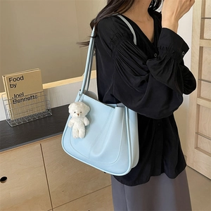 Minimalist light blue faux leather square tote bag with cute teddy bear plush charm