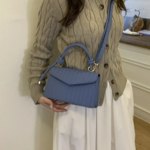 Chic blue woven crossbody bag with knotted handle and gold metal hardware for women