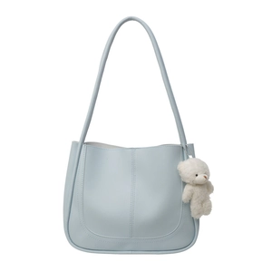 Light blue faux leather square shoulder bag with white plush bear charm and U-shaped stitching