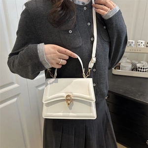 Minimalist off-white PU leather crossbody bag with golden ring clasp and geometric stitching