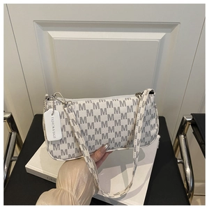 Detail of white crescent bag with gray M-pattern and silver metal zipper hardware