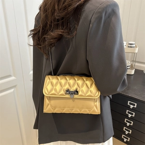 Golden quilted chain crossbody bag with rhombic stitching and metallic lock for women