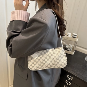 Chic crescent hobo bag with vintage M-letter print and silver zipper detail