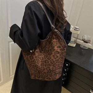 Modern leopard print tote bag with large capacity shown on model in a stylish interior