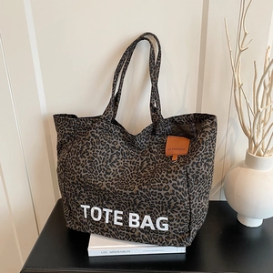 Large capacity leopard print canvas tote bag with white TOTE BAG lettering and handles