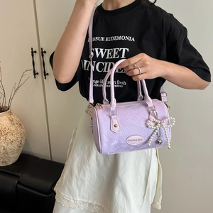 Lavender faux snake skin pillow bag with pearl bow charm and adjustable strap