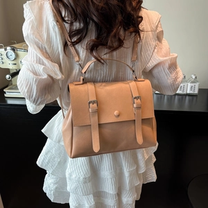 Minimalist apricot faux leather backpack with metallic buckle accents for daily casual wear