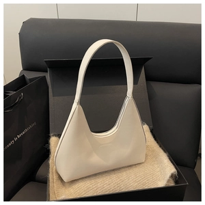 Chic beige underarm bag displayed in premium gift box with soft knit fabric
