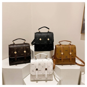 Detailed view of mini backpacks in four colors with bear prints and leather texture