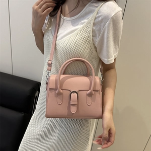 Pink minimalist crossbody bag for women with top handle and silver hardware detail