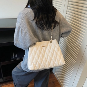 Minimalist white quilted shoulder bag with gold chain strap and metal logo for women