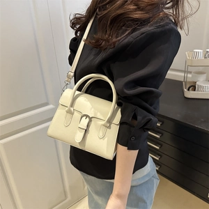 Minimalist beige PU leather square crossbody bag with top handle and adjustable strap