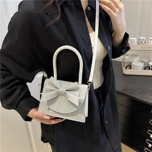 Trendy silver sequin square handbag with bow detail and white top handle for women