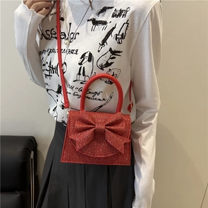 Fashionable red glitter square handbag with large bow and crossbody strap for women