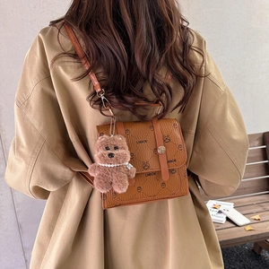 Chic brown leather backpack for women with teddy pendant and cartoon pattern