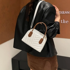 White quilted crossbody handbag with brown handles and elegant Korean style shoulder strap