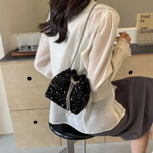 Elegant black sequin bucket bag with silver chain and pearl charms for women