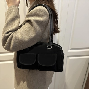 Chic black faux suede underarm bag with dual front pockets and silver hardware