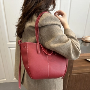 Red lychee pattern leather tote bag with white contrast stitching for women