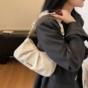 Chic white ruched cloud bag for women with elegant pleated strap and golden logo