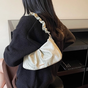 Fashionable ruffled shoulder bag in pearl white with elegant pleated strap and cloud design