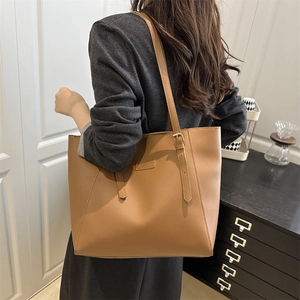 Vintage large brown leather tote bag for women shown as casual shoulder bag style