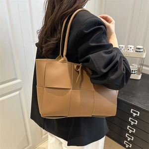 Brown woven leather shoulder bag for women with large minimalist tote design