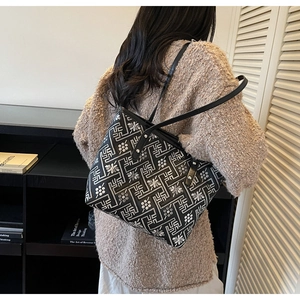 Detail view of ethnic geometric print tote bag with long black shoulder straps