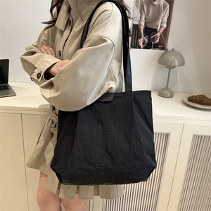 Chic black wrinkled nylon tote bag for women with fashion label and large capacity