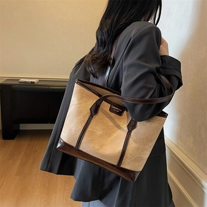 Retro beige suede tote bag with brown leather trim and metal logo for women