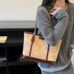 Vintage suede shoulder tote bag with dark brown leather trim and retro aesthetic