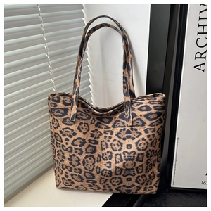 Close-up of the leopard print pattern and fabric texture of the large canvas tote bag