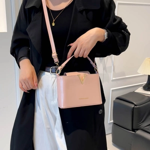 Pink fashion leather crossbody bag for women with gold V-metal decor and shoulder strap