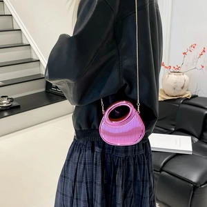Metallic pink mini evening bag with round handle and gold chain strap for women