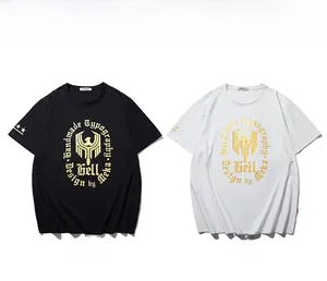 Flat lay of black and white cotton t-shirts featuring gold eagle graphic prints