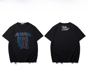 Macro detail of the Born to Ride colorful gradient print on a black cotton t-shirt
