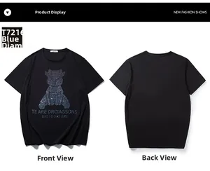 Detail of blue rhinestone geometric animal print on oversized black cotton T-shirt