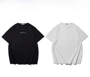 Detail of round neck cotton t-shirts with elegant gold print in black and white colors