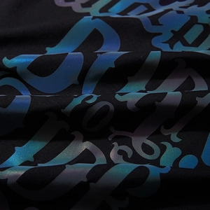 Black oversized t-shirt with rainbow reflective gothic lettering and knit texture