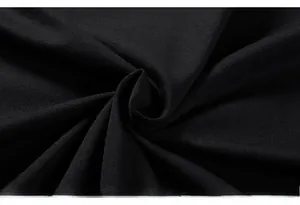 Detailed macro view of high-quality black knit fabric texture for oversized printed t-shirt