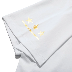 White cotton t-shirt sleeve with decorative gold star foil print and metallic finish