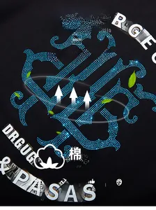 Detail of cotton fabric breathability and blue rhinestone pattern on black oversized T-shirt