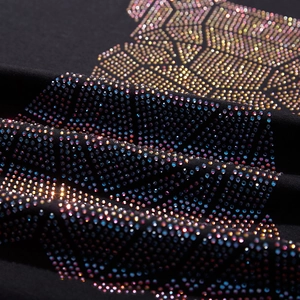 Black street style oversized t-shirt featuring colorful geometric rhinestone design