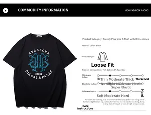 Detail of loose fit black cotton T-shirt with blue geometric rhinestone design